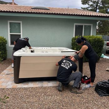 A&J Spa Pros team setting up a hot tub