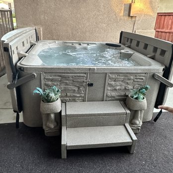 Beautifully installed spa with stone steps
